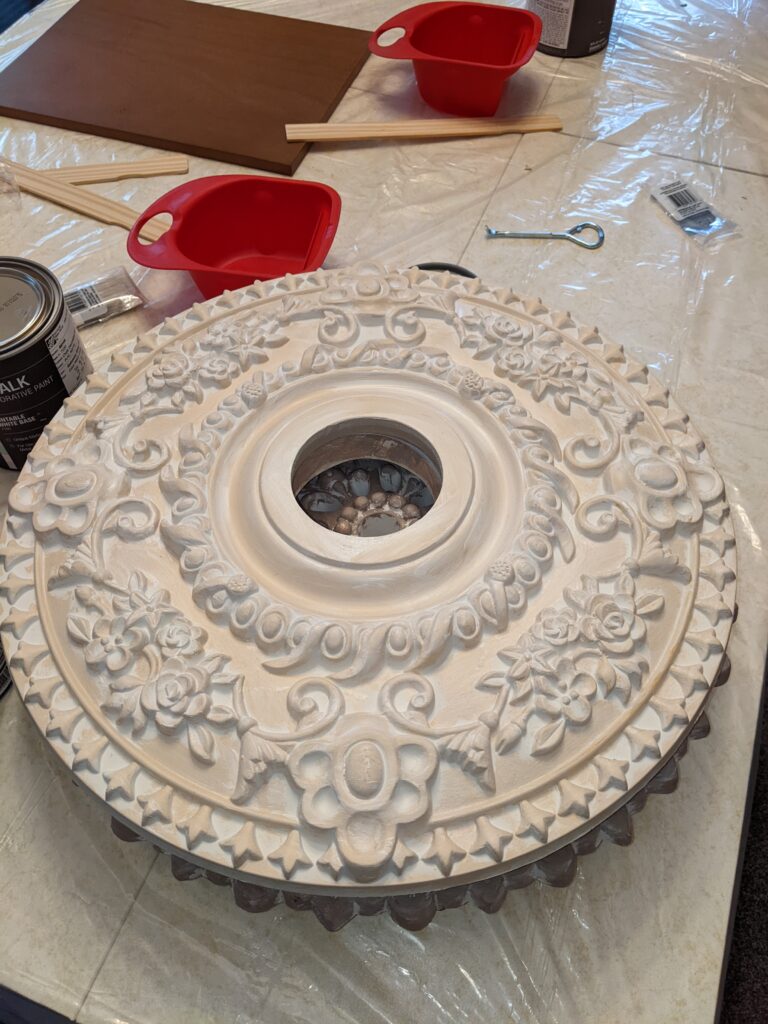 anohter before of another ceiling medallion. This one is very peach in color.