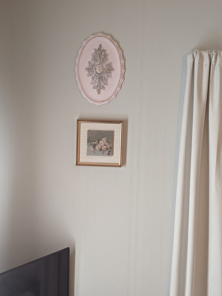 Wall after the painted ceiling medallion was hung above the art work.
