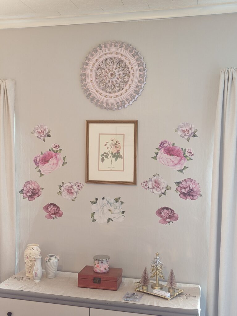 After the large painted ceiling medallion was hung above the piece of art work and the peel and stick floral wall decals.