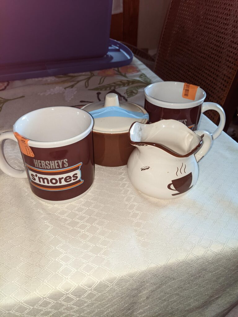 Hershey's mugs, brown sugar container and white with browm cream container