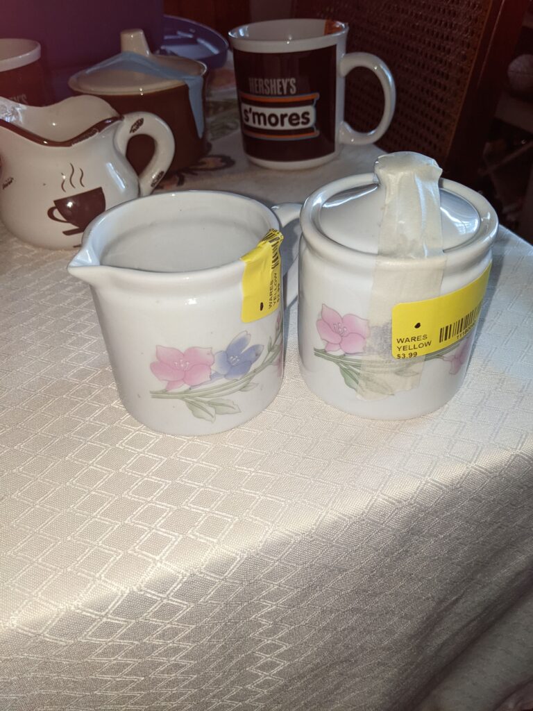 White Porcelain with pastel floral design, cream and sugar set.